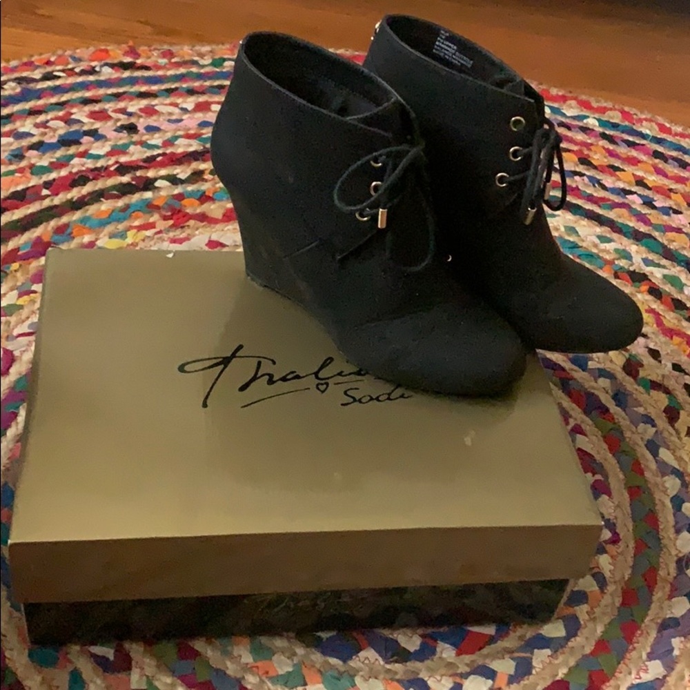 Black wedge booties with gold accent